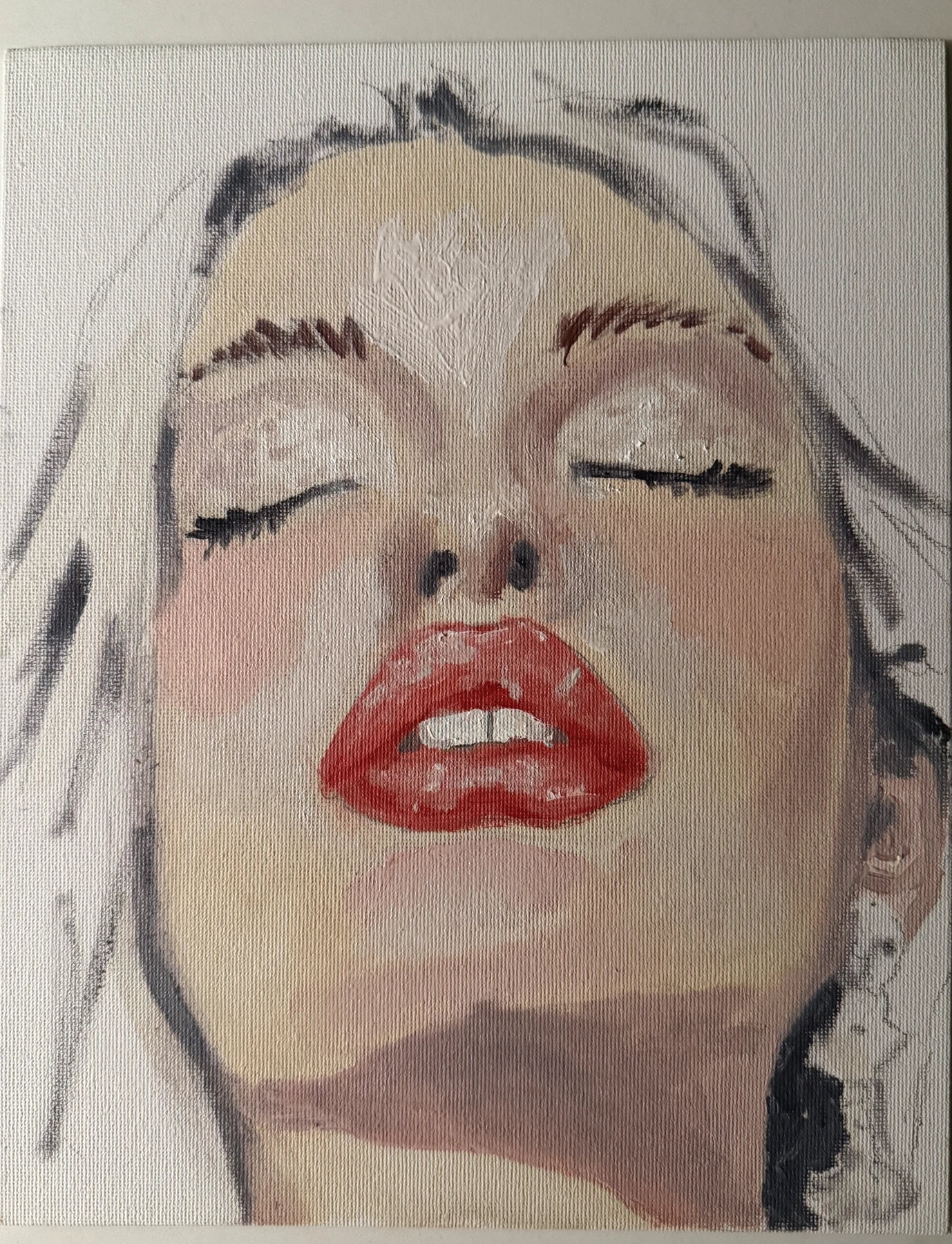 A face with closed eyes, loose hair, and red lips on white canvas.